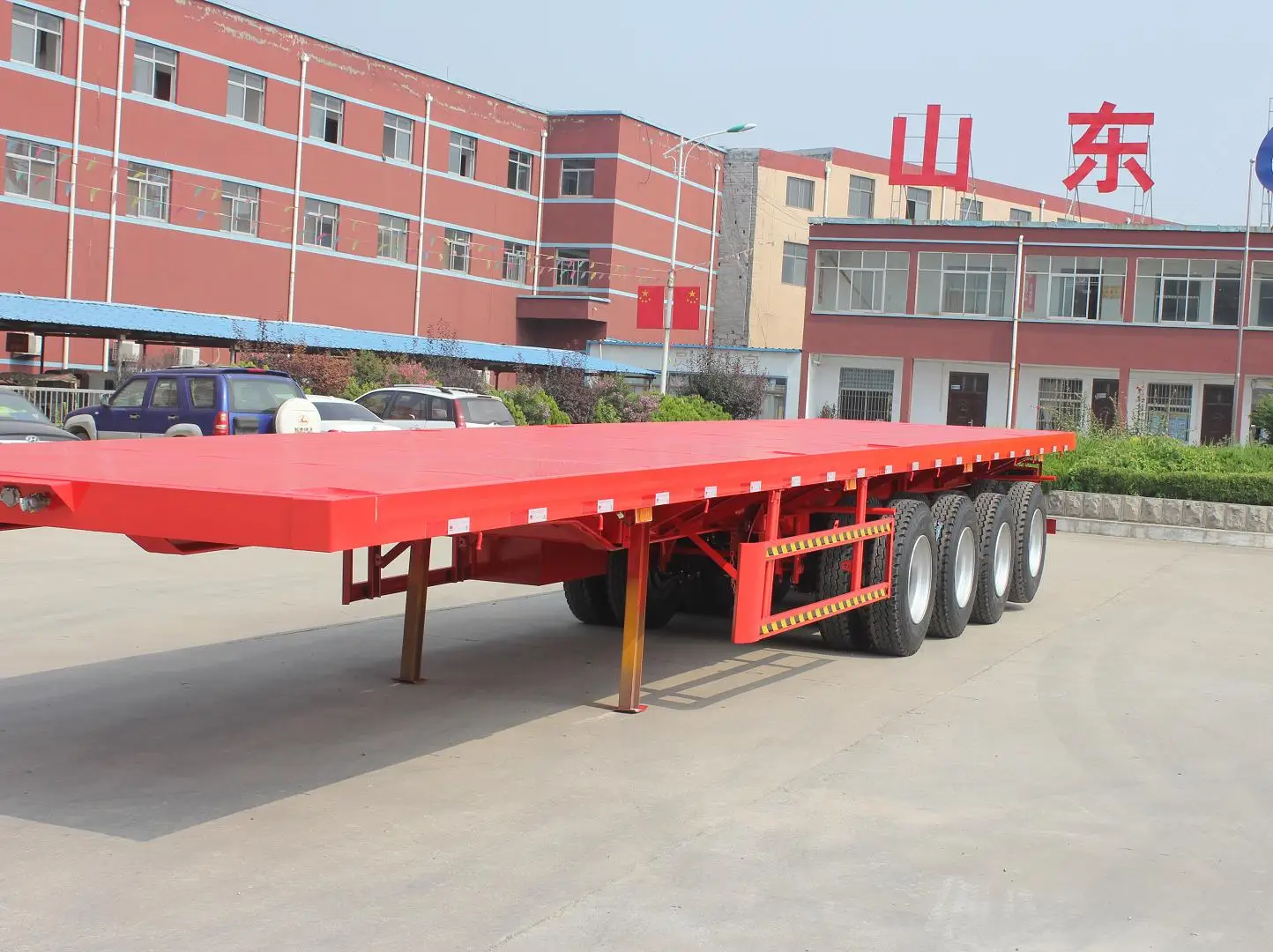 重型平板车40英尺长板集装箱平板拖车出售在巴基斯坦平甲板拖车