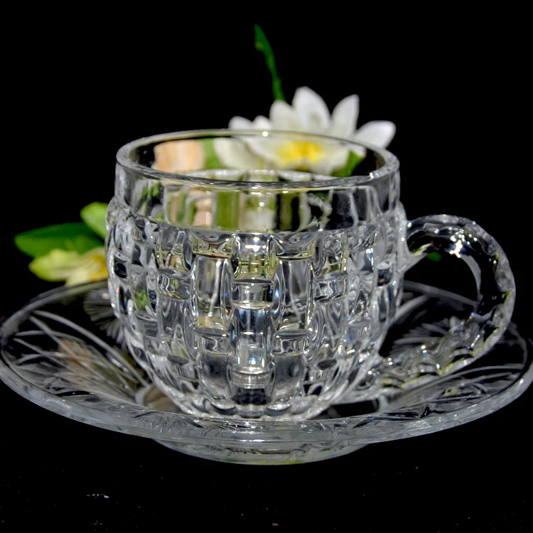 clear glass tea cups and saucers