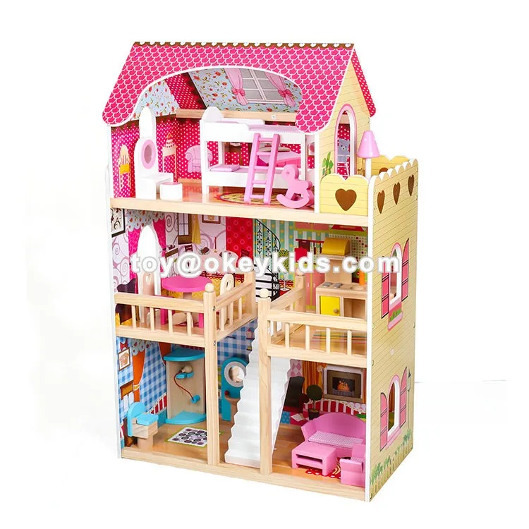 pink wooden dolls house