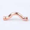 Copper cross-over fitting for plumbing and refrigeration