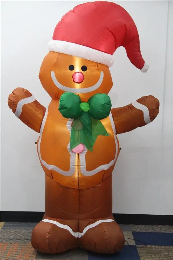 The Inflatable Christmas Gingerbread Man With Light Wearing A Green