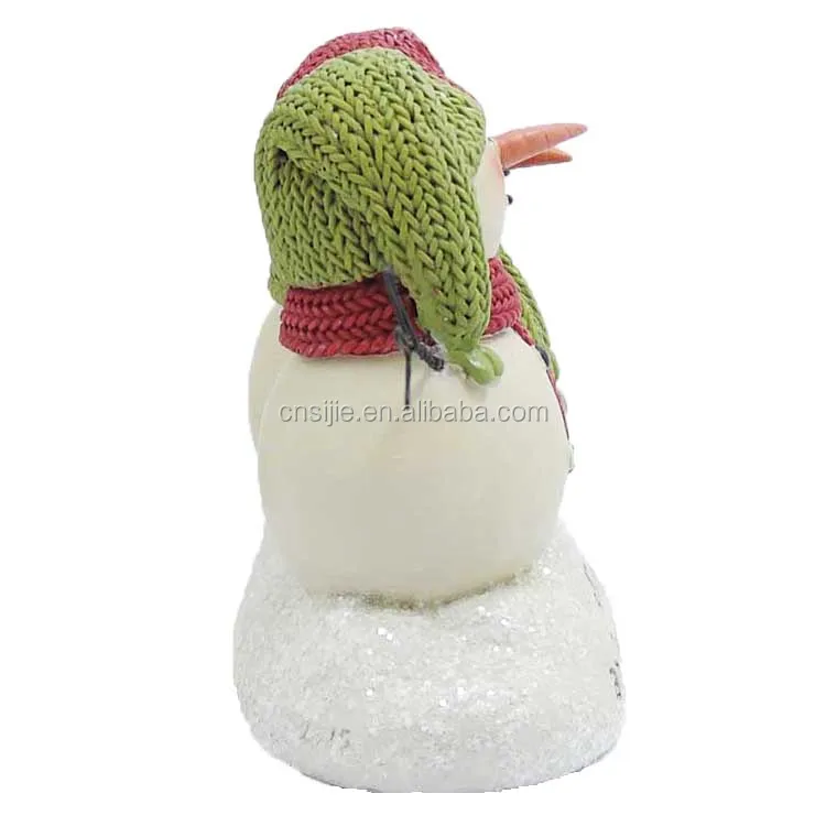 The polyresin Christmas  gift  which snuggle up watch snow' snowmen on base(m2)