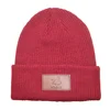 Wholesale pink leather label knitting classic colors leather label hat winter beanie hat
