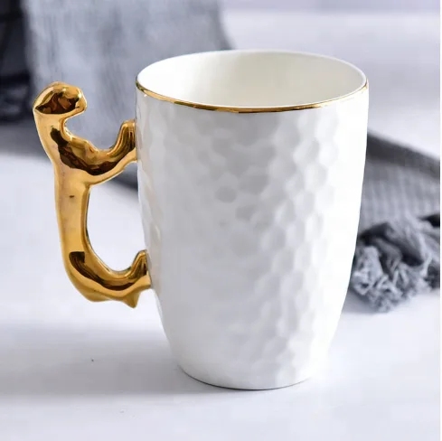 

Promotional Christmas gift fine bone china sublimation custom ceramic embossed coffee mug with gold tiger handle, White