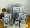 /product-detail/high-quality-luxury-silvery-metal-photo-frame-desktop-curved-picture-frame-display-60679062181.html