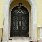 Arch top wrought iron front entry double door