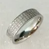 Matte Finish Stainless Steel Central Four CZ Crystals Prong Setting Inlay Comfort Wedding Band Engagement Rings OEM Collection