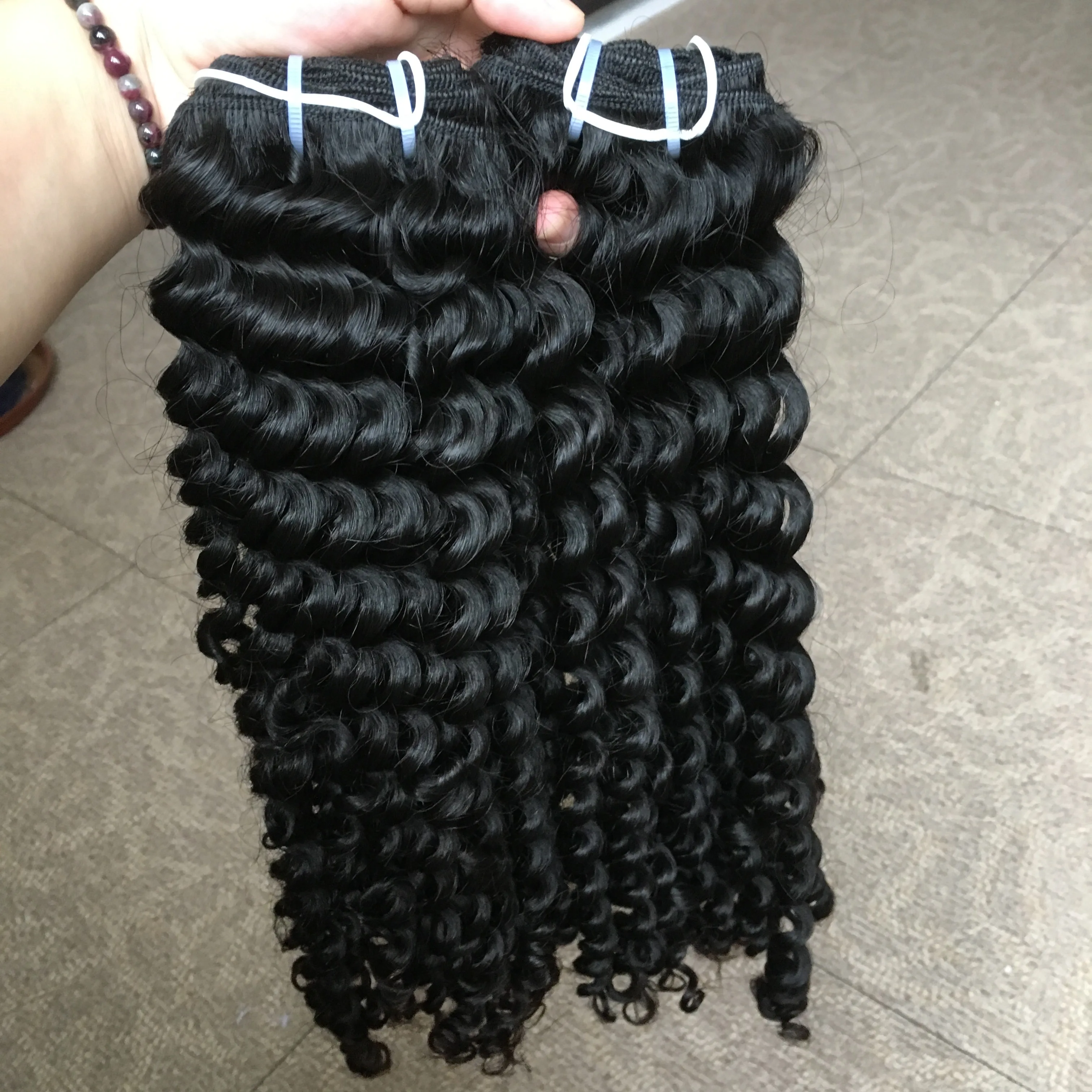 

The best selling curly human hair raw indian hair unprocessed virgin cuticle aligned hair from india