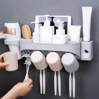 

2019 New Design Wall Mounted Bathroom Plastic Toothbrush Holder and Toothpaste Dispenser with Suction Cups Set for Tooth Brush