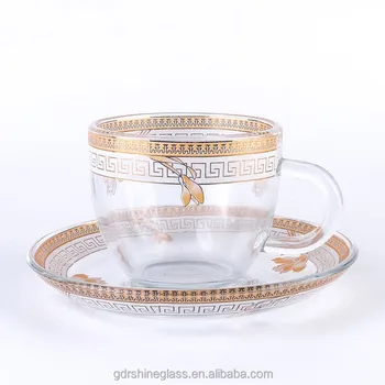 clear glass tea cups and saucers