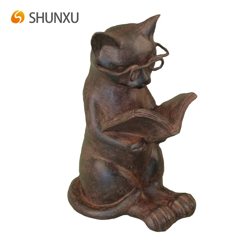 cat reading figurine