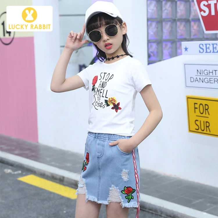 

5-14 Years Old Kids Clothes 2 Piece Embroidery Rose Designer Children White Two Piece Short T-Shirt And Denim Kids Skirt Set