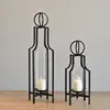 Custom long-stemmed hanging brass candlestick