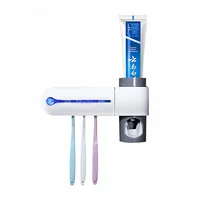 

Toothpaste dispenser and toothbrush sterilizer holder uv toothbrush sanitizer