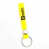 Bulk cheap fashion colorful custom logo debossed silicone bracelet key chain Key Ring
