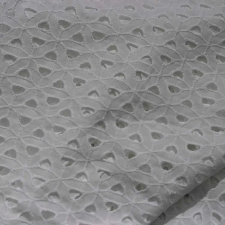 white cotton fabric with holes