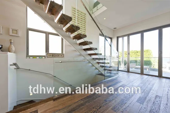 
Single spine stringer stairs with 12mm frameless glazed balustrades and Flat bar handrails 