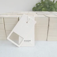 

Custom design luxury embossed white cardboard paper clothes hang tag label