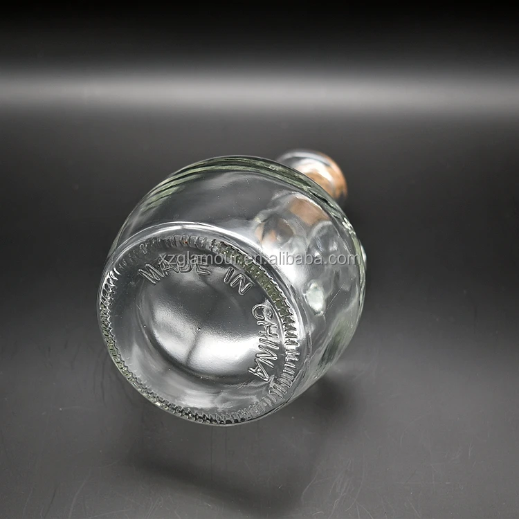 
clear glass pot dispenser with bird beak for olive oil or vinegar 