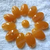 Dyed orange jade oval cabochon for jewelry setting