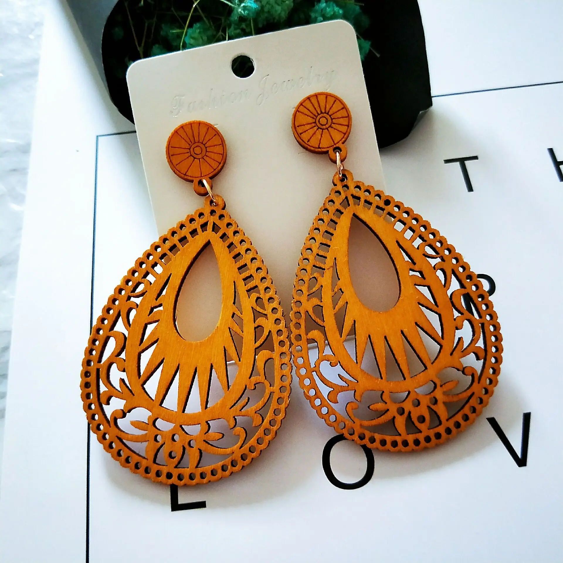 

Elegant Hollow Natural Wood Flower Pattern Statement Earrings