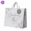 /product-detail/wholesale-custom-printed-fancy-christmas-250-gsm-art-ivory-board-gift-paper-bag-with-cotton-handle-60702266230.html