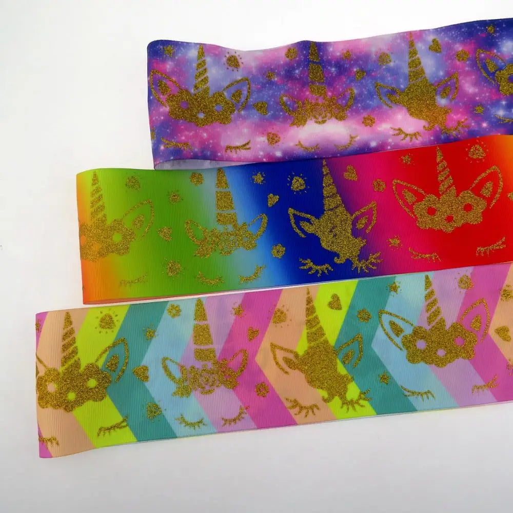 

3 inch ()gold glitter unicorn printed with rainbow grosgrain ribbon