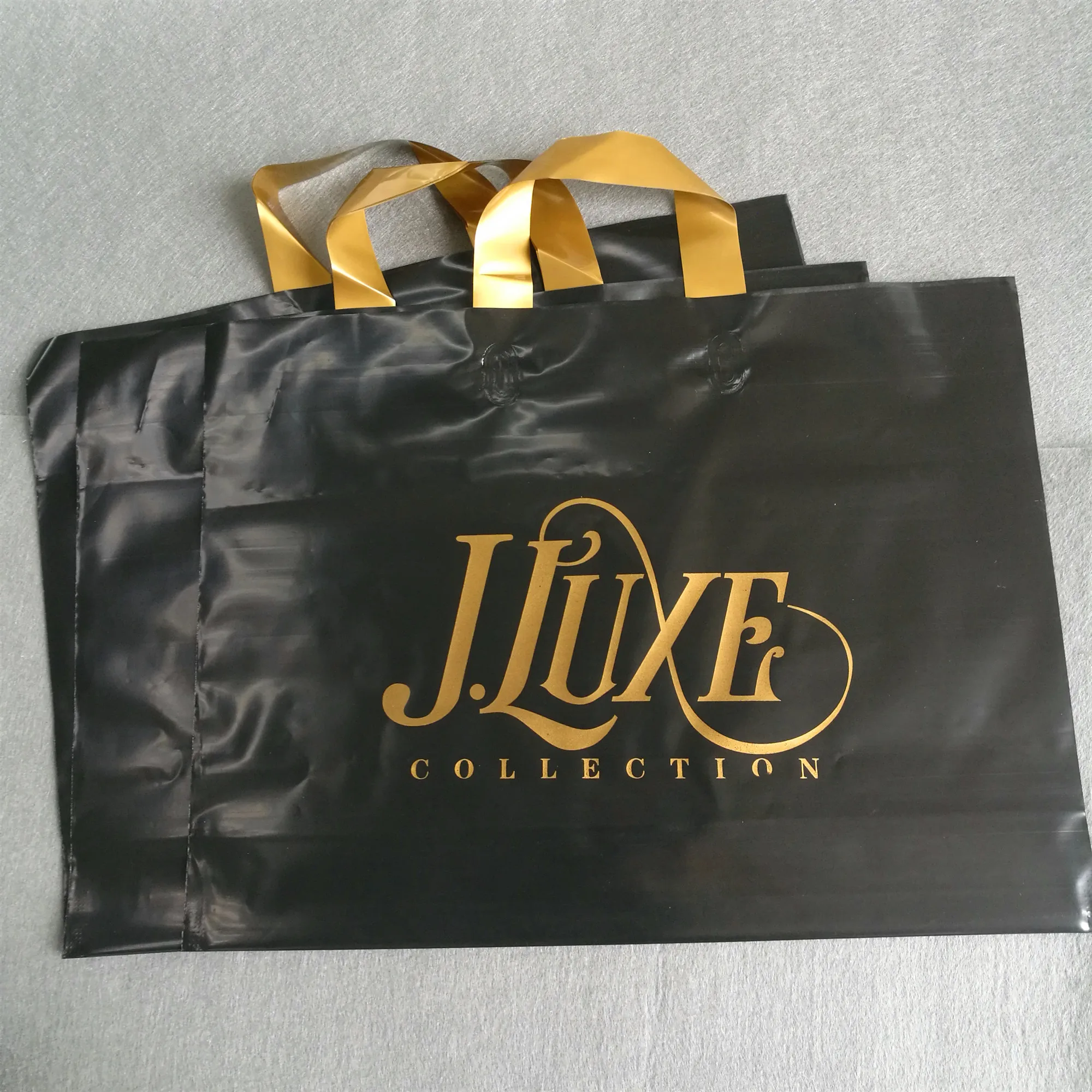 

custom design large size black bag with gold logo printed LDPE/HDPE soft loop handle bag for clothing, Cmky as well as pms, customized