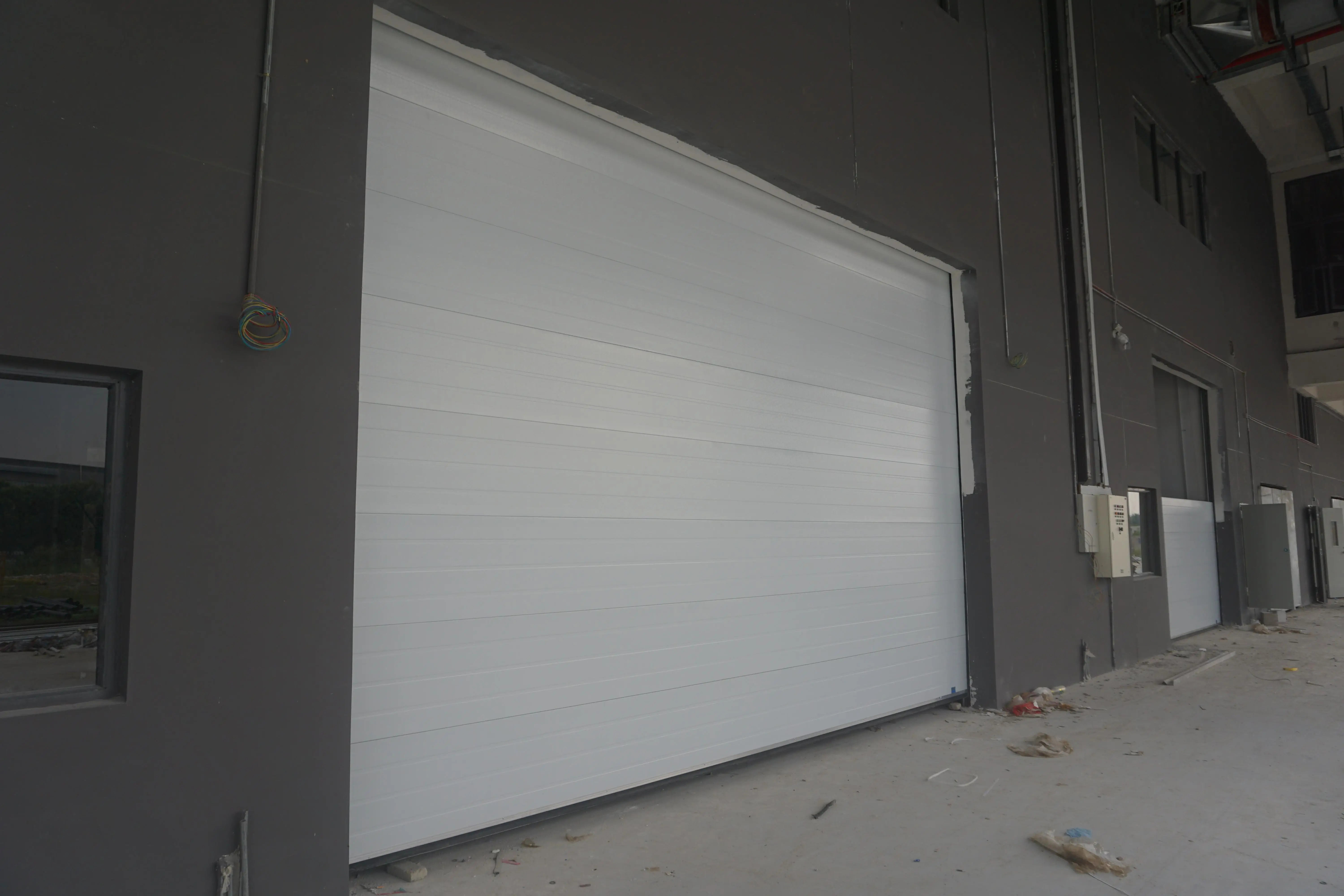 product-Zhongtai-Ready To Ship Vertical Electrical Factory Price Industrial Lifting Door for Factory