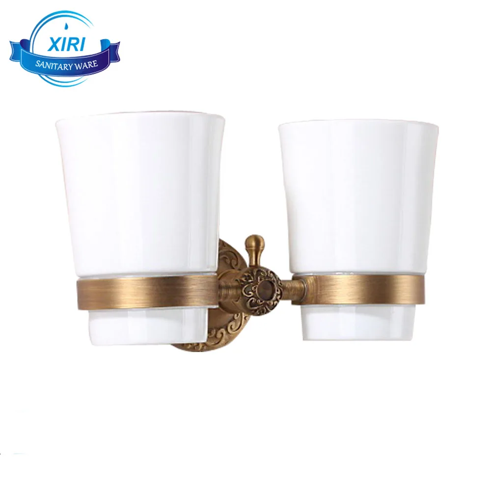 
double antique brass wall mounted cup holder for holding bathroom tool 