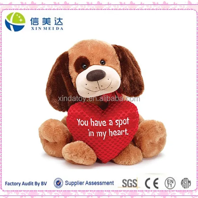 sitting plush brown dog holding a big red heart saying 