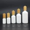 white glass bottle packaging gold bottom bamboo pressure dropper 10ml 15ml 30ml 50ml 100ml white glass dropper bottle