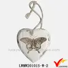 Shabby chic white wooden love hearts with painted butterfly