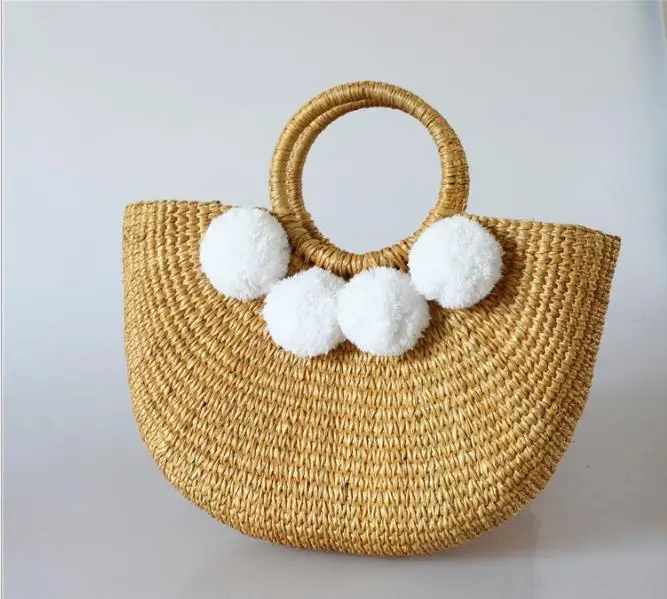 

natural straw handbag hand woven round handle pompom summer beach bag chic bag made by artisan