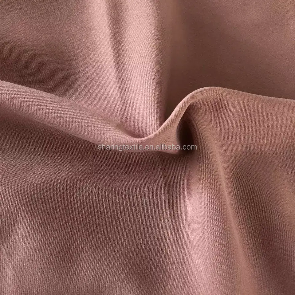 
100% Polyester Peach Skin Fabric /Micro Fiber Fabric 100Gsm 75D*150D Stock Lot Plain Peach Skin Fabric For Beach Shorts 