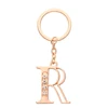 Latest design wholesale custom rose gold metal white crystal letter r keychains