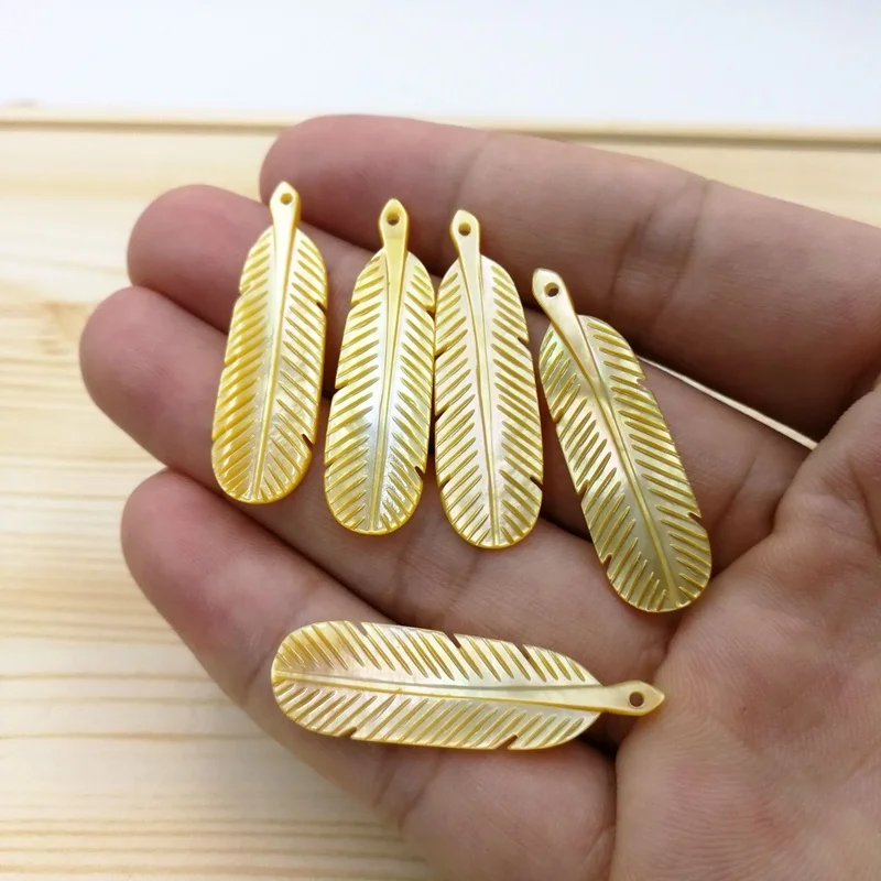 

Wholesale Accessories Women Jewelry Making Leaf Feather Shape Yellow Shell Pendant Mother of Pearl MOP Beige Stone Pendants, Beige yellow