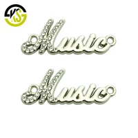 

Zinc alloy clothing letter logo custom engraved brand metal labels with diamonds