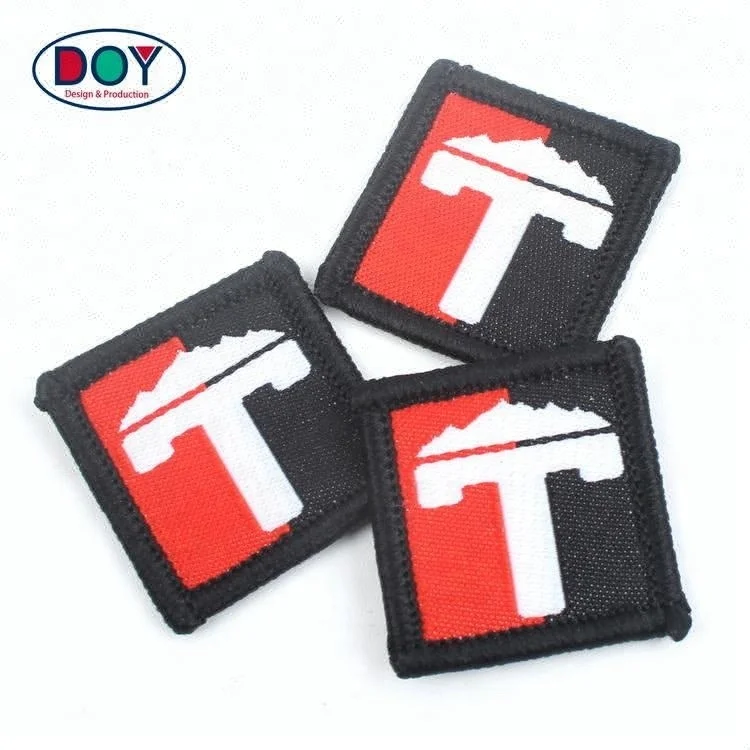 

Wholesale Sew on Custom Colorful Brand Logo Merrow Border Machine Woven Small Patches for Hats, Follow pantone color chart