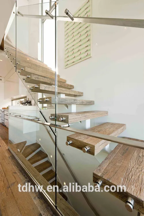 
Single spine stringer stairs with 12mm frameless glazed balustrades and Flat bar handrails 