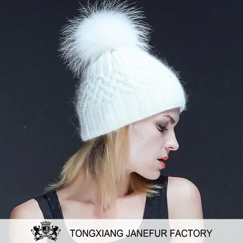 hat with fur ball on top