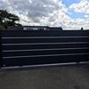 Horizontal slatted powder coated aluminium sliding gate with motor
