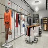 custom garment display stand wood and metal clothes display clothing showroom design