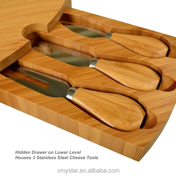 
Natural round bamboo cheese board with 3 cheese knives in slide-out drawer 