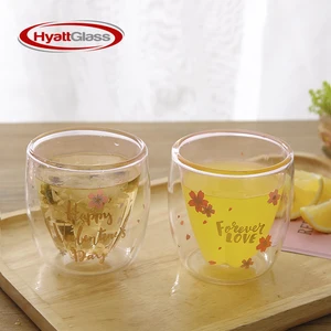 Image of high borosilicate Transparent Sakura-printed double walled drinking glass