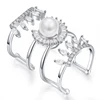 Crown and sector decorated white crystal ring with three rings