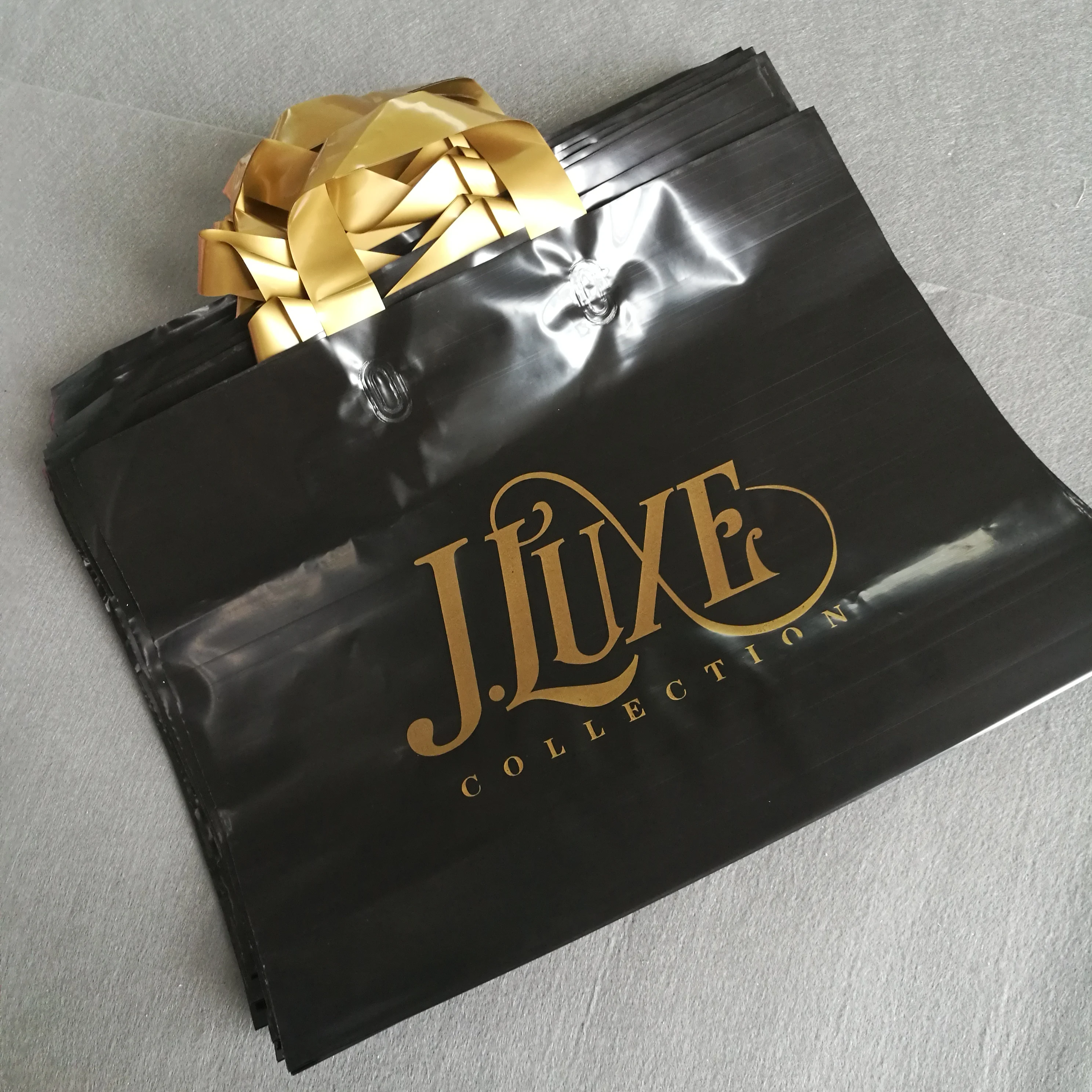 

custom design black bag with gold logo print LDPE/HDPE soft loop handle bag for shopping, Customized color