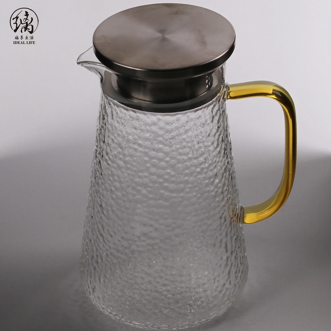 jarra agua vidrio resistente a altas temperaturas con tapa mango blanco