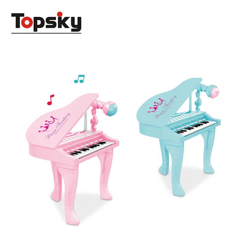 toy grand piano with microphone