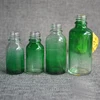 Blue pink purple green glass container with unique fancy cap for electronic cigarette oil with paper box packaging